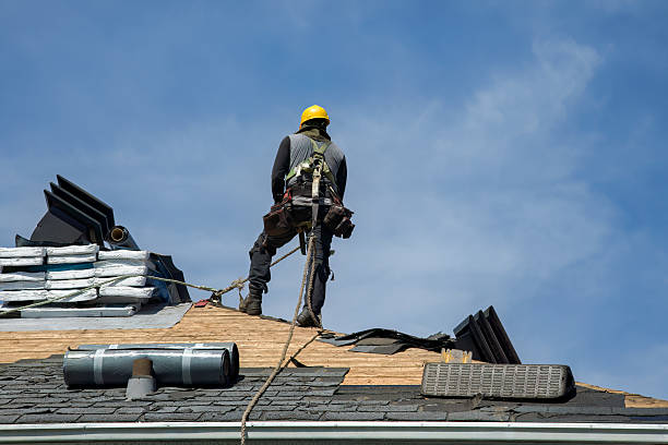 Professional Roof Replacement technician working in Alma, MI